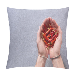 Personality  Cropped Shot Of Man Holding Dried Chili Peppers In Hands With Grey Surface On Background Pillow Covers