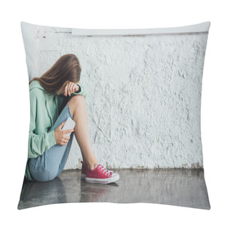 Personality  Sad Crying Girl Sitting Near Textured Wall And Holding Smartphone Pillow Covers