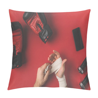 Personality  Cropped Shot Of Boxer Covering Up Hands In Elastic Bandage On Red Surface Pillow Covers