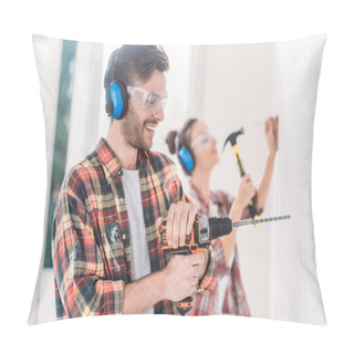 Personality  Happy Young Man Using Electric Drill During House Repairment Pillow Covers