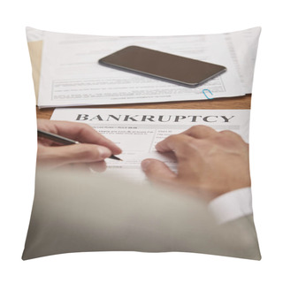 Personality  Cropped View Of Businessman Filling In Bankruptcy Form At Wooden Table With Smartphone Pillow Covers