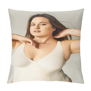 Personality  Portrait Of Brunette Curvy Woman With Plus Size Body Posing In Beige Bodysuit While Standing And Touching Hair In Studio On Grey Background, Body Positive, Figure Type, Looking At Camera  Pillow Covers
