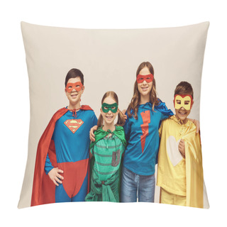 Personality  Happy Interracial Kids In Colorful Costumes With Cloaks And Masks Smiling And Hugging Each Other While Looking At Camera On Grey Background In Studio, Child Protection Day Concept  Pillow Covers