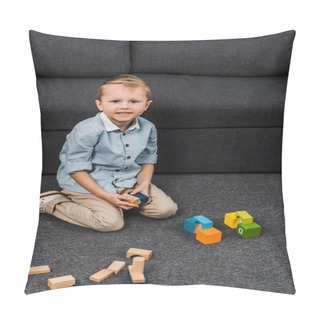 Personality  Smiling Boy With Multicolored Wooden Blocks Sitting On Floor And Looking At Camera In Living Room Pillow Covers