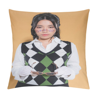Personality  Portrait Of Stylish Asian Woman In Gloves Holding Sunglasses On Orange Background Pillow Covers