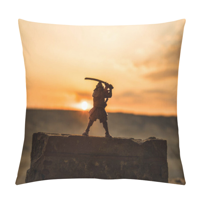 Personality  Fighter with a sword silhouette a sky ninja. Samurai on top of mountain with dark toned foggy background. Selective focus pillow covers