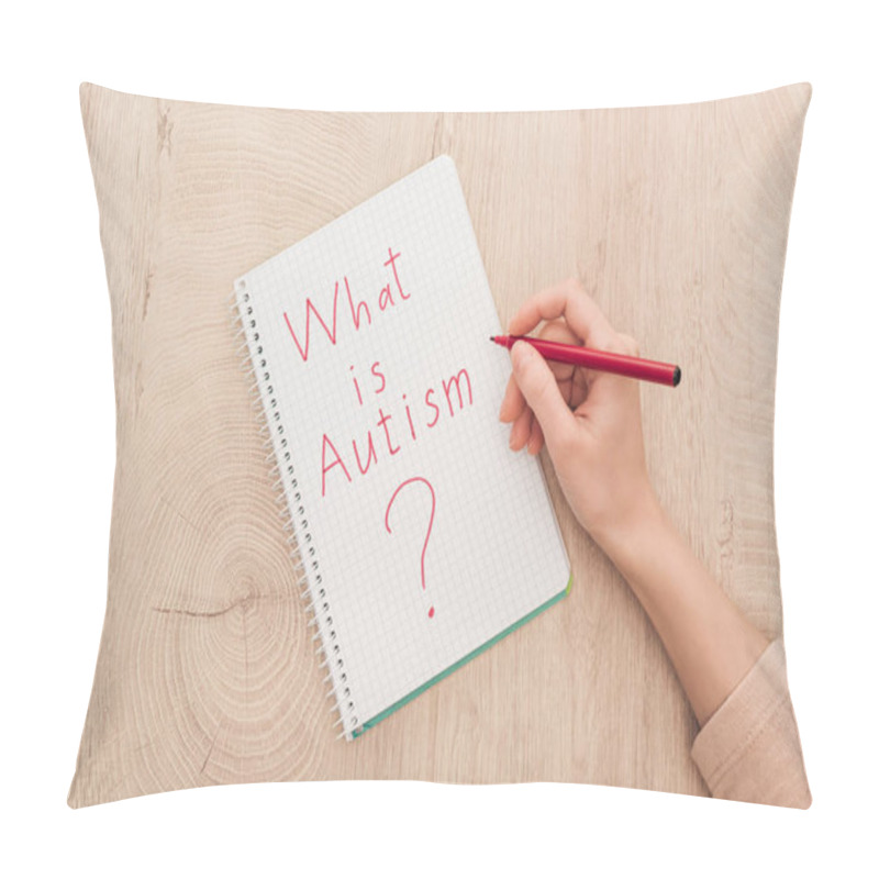 Personality  Cropped View Of Woman Writing In Notebook What Is Autism Question On Wooden Table Pillow Covers