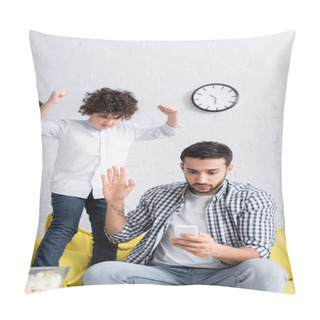 Personality  Irritated Arabian Kid Holding Clenched Fists Near Busy Father Messaging On Smartphone And Showing Stop Gesture Pillow Covers