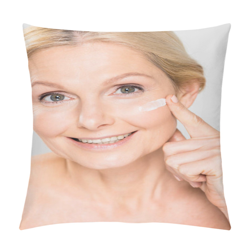 Personality  Beautiful And Mature Woman Looking At Camera And Applying Cosmetic Cream On Face Isolated On Grey  Pillow Covers