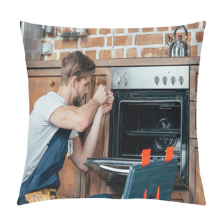 Personality  Young Repairman In Protective Workwear Fixing Oven In Kitchen Pillow Covers
