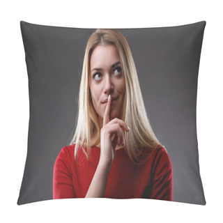 Personality  With A Knowing Look, She Gestures For Quiet, Wrapped In Red Pillow Covers