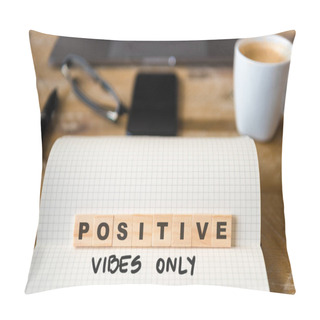 Personality  Closeup On Notebook Over Wood Table Background, Focus On Wooden Blocks With Letters Making Positive Vibes Only Text. Concept Image. Laptop, Glasses, Pen And Mobile Phone In Defocused Background Pillow Covers