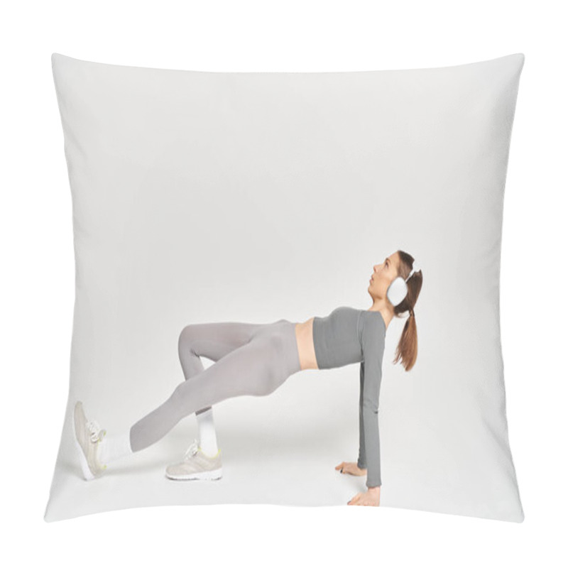 Personality  A Sporty Young Woman Performs A Side Plank Exercise With Grace And Strength On A White Background. Pillow Covers