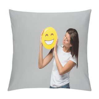 Personality  KYIV, UKRAINE - SEPTEMBER 10, 2019: Attractive Woman Holding Yellow Happy Smiling Emoji, Isolated On Grey Pillow Covers