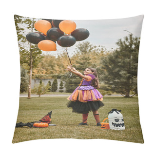 Personality  Joyful Girl In Halloween Costume Holding Balloons Near Pumpkin, Witch Hat And Candy Bucket On Grass Pillow Covers