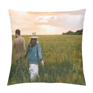 Personality  Back View Of Couple Holding Hands And Walking On Green Meadow At Sunset Pillow Covers