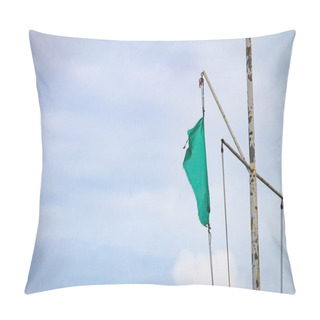Personality  Tattered Torn Ripped Green Flag On A Rusty Iron Pole Against A Cloudy Sky Background. Copy Space. Pillow Covers
