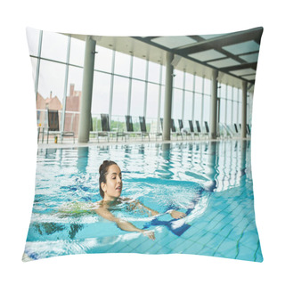 Personality  A Young And Beautiful Brunette Woman Peacefully Swims In A Large Indoor Pool At A Luxurious Spa. Pillow Covers