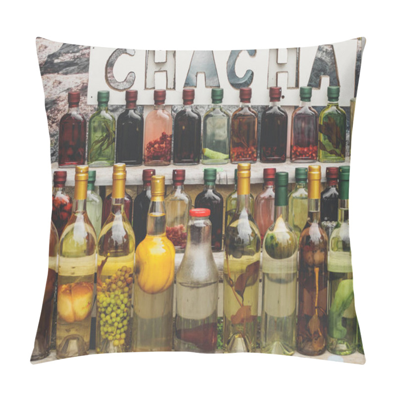 Personality  traditional georgian alcohol drink chacha in bottles with different fruits and herbs selling at market pillow covers