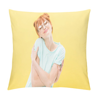 Personality  Pleased Redhead Girl In Glasses And T-shirt Embracing Herself With Closed Eyes Isolated On Yellow Pillow Covers