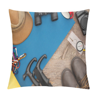 Personality  Top View Of Hiking Equipment On Blue Sleeping Pad, Photo Camera, Boots And Hat On Wooden Surface Pillow Covers