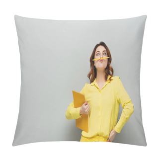 Personality  Cheerful Woman With Pencil Between Nose And Lips Posing With Notebook On Grey Pillow Covers