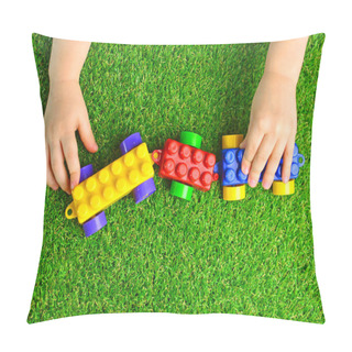 Personality  Artificial Turf. Baby Plays With A Building Kit Train On A Green Artificial Grass. Kindergarten Background.   Pillow Covers