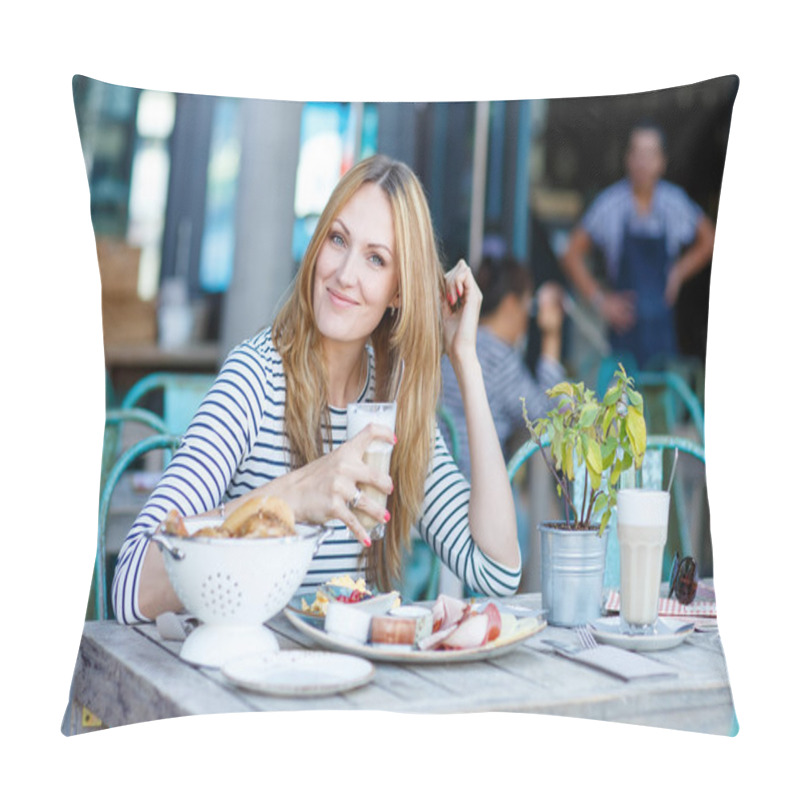 Personality  Young woman having healthy breakfast in outdoor cafe pillow covers