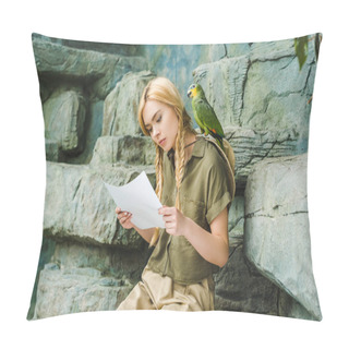 Personality  Beautiful Young Woman In Safari Suit With Parrot On Shoulder And Map Sitting On Rocks Pillow Covers