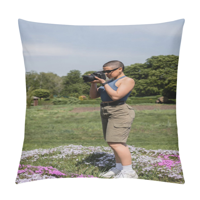 Personality  Short Haired Female Tourist In Sunglasses And Fitness Tracker Taking Photo On Digital Camera While Standing On Lawn With Flowers With Blurred Nature At Background, Connecting With Nature Concept Pillow Covers