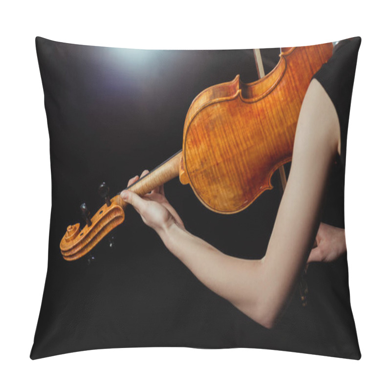 Personality  cropped view of professional female musician playing on violin on dark stage pillow covers