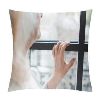 Personality  Cropped View Of Upset Elderly Woman Looking Through Window During Self Isolation Pillow Covers