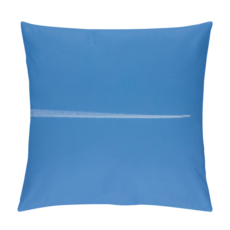 Personality  A passenger jet plane flying accross a deep blue sky leaving a long white jet stream trailing behind. pillow covers