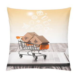 Personality  Selective Focus Of Toy Shopping Cart With Small Carton Boxes On Laptop Keyboard Near Illustration On Orange, E-commerce Concept Pillow Covers