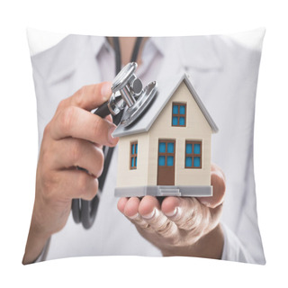 Personality  Close-up Of A Doctor's Hand Examining House Model With Stethoscope Pillow Covers