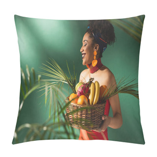 Personality  Smiling Young African American Woman In Red Swimsuit Holding Basket With Exotic Fruits On Green Pillow Covers