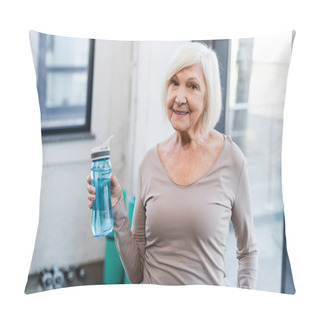 Personality  Grey Haired Sportswoman With Sports Bottle Smiling At Camera In Gym  Pillow Covers