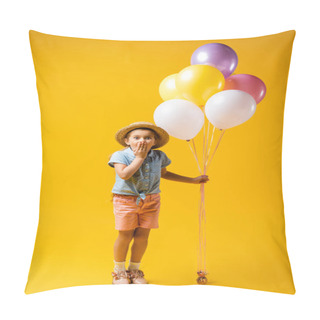 Personality  Full Length Of Shocked Kid In Straw Hat Covering Mouth And Holding Balloons On Yellow Pillow Covers