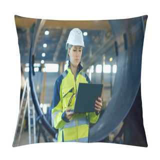 Personality  Female Industrial Engineer In The Hard Hat Uses Laptop Computer While Standing In The Heavy Industry Manufacturing Factory. In The Background Various Metalwork Project Parts Lying Pillow Covers