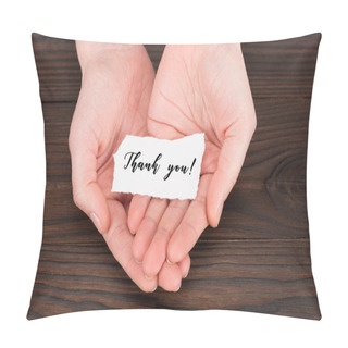 Personality  Cropped Shot Of Woman Holding Paper With Thank You Lettering Over Wooden Table Pillow Covers