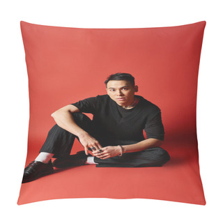 Personality  Stylish Asian Man In Black Attire Sitting On The Ground With Legs Crossed In A Zen Pose On A Vibrant Red Background. Pillow Covers