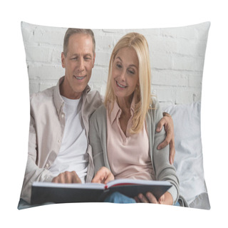 Personality  Smiling Couple Looking At Notebook While Sitting On Bed Pillow Covers