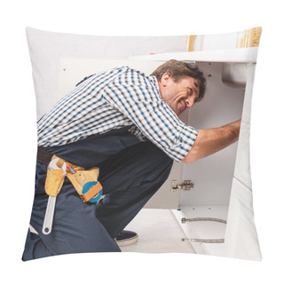 Personality  Side View Of Repairman In Uniform And Tool Belt Fixing Kitchen Sink  Pillow Covers