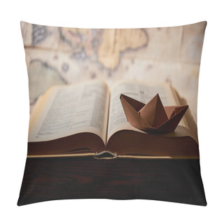 Personality  Selective Focus Of Paper Boat, Book And Map On Table Pillow Covers