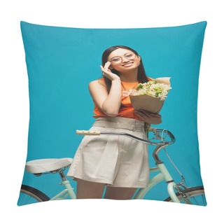 Personality  Happy Asian Girl In Glasses Holding Flowers Near Bike Isolated On Blue Pillow Covers
