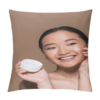 Personality  Positive Asian Woman With Naked Shoulders Applying Face Cream Isolated On Brown  Pillow Covers