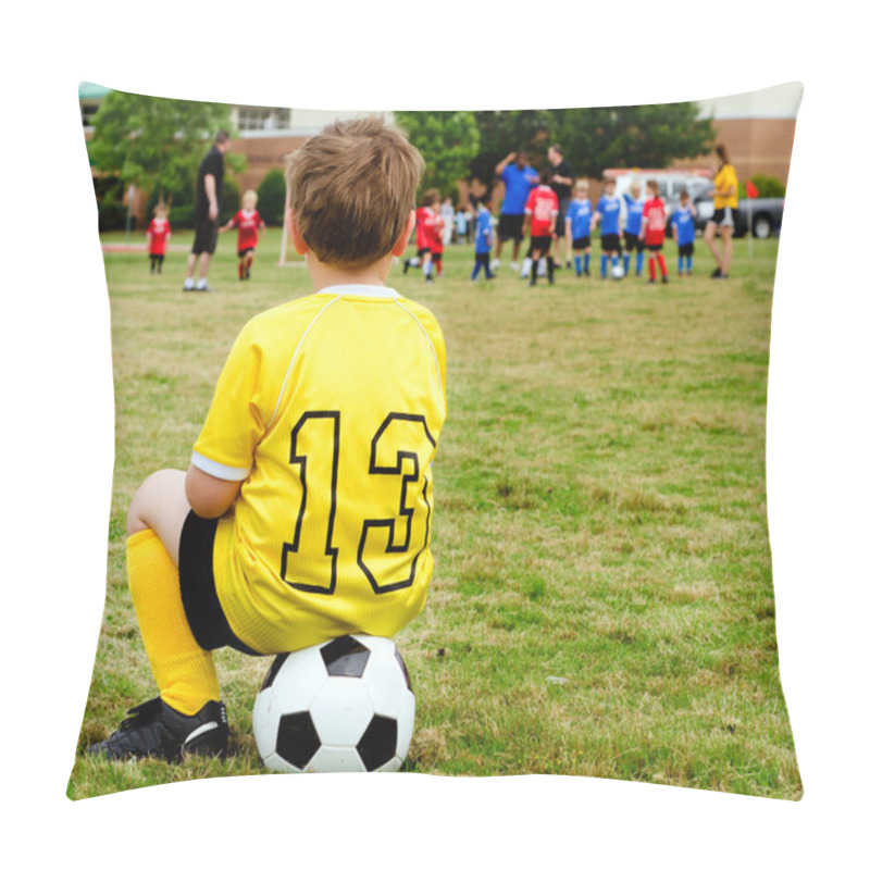 Personality  Young boy child in uniform watching organized youth soccer or football game from sidelines pillow covers