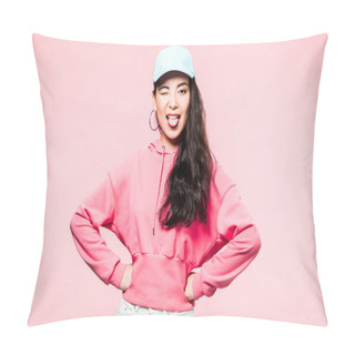Personality  Attractive Asian Woman In Pink Pullover And Cap Winking And Sticking Out Tongue Isolated On Pink  Pillow Covers