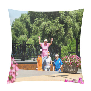 Personality  Selective Focus Of Happy Retired Woman Celebrating Triumph Near Multicultural Pensioners In Park  Pillow Covers