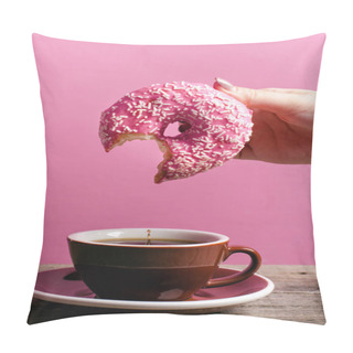 Personality  Woman Hand Holding Colorful Donut With Sprinkles On A Wooden Table And Pink Background. Cup Of Coffee. Concept Of Food. Donut With Bite Missing Close Up. Pastel Color  Pillow Covers